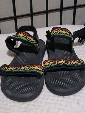 Reef Black Sandals with Red, Yellow and Green Patterned Strap
